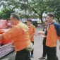 BPBD Lebak saat membagikan nasi kotak kepada masyarakat memperingati HUT Kabupaten Lebak 194. (Istimewa)